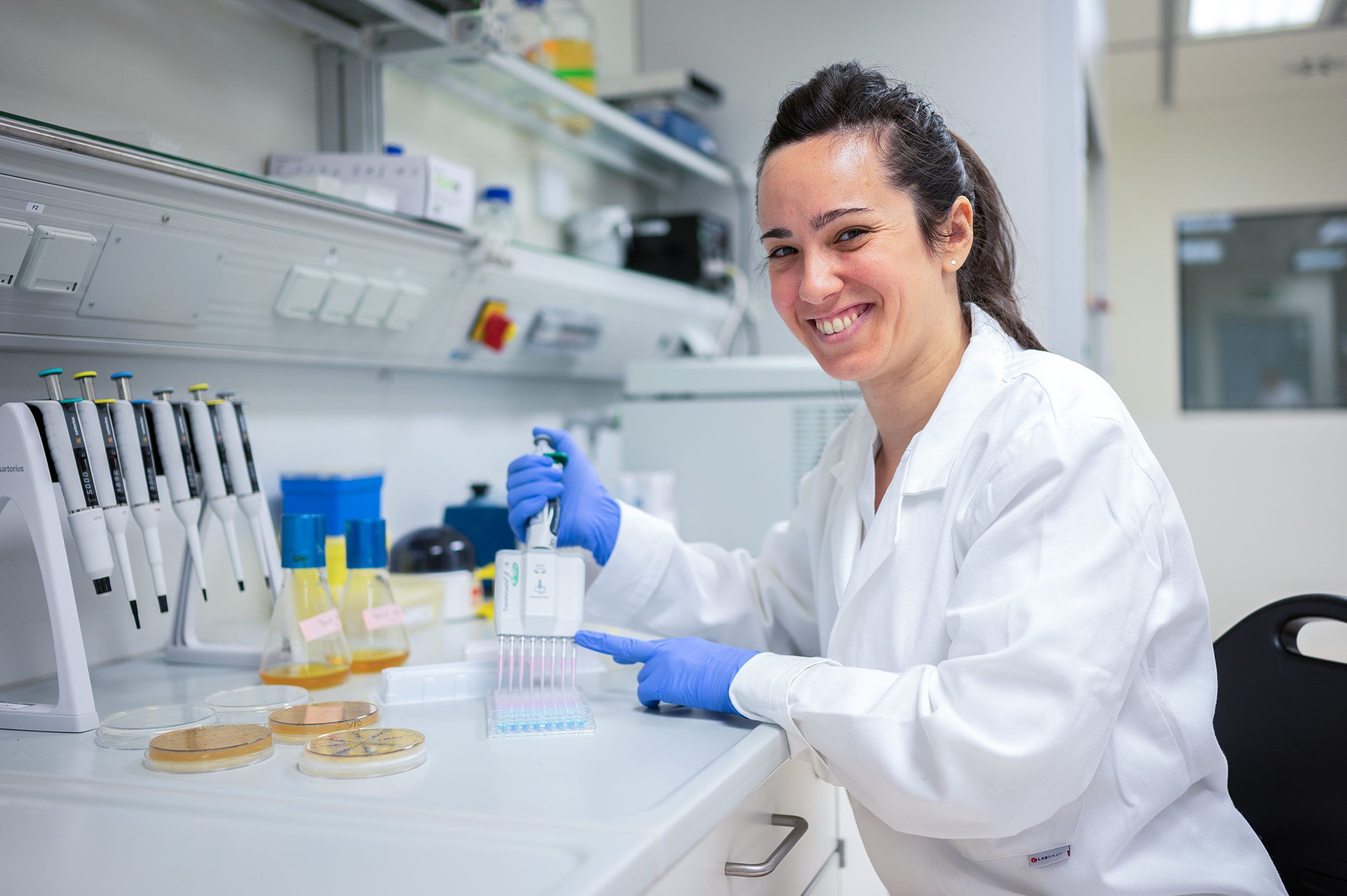 Woman sitting in a laboratory.